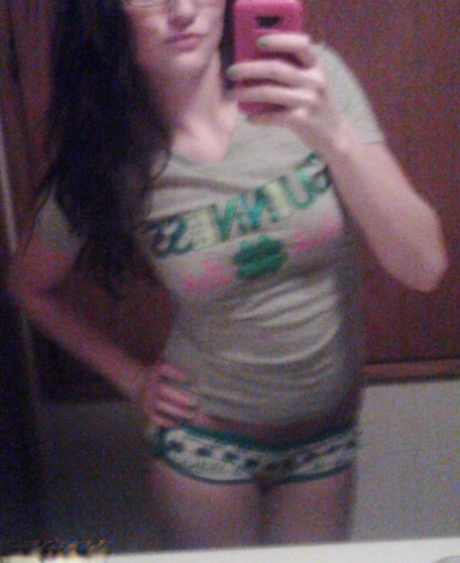 Amateur girl Freckles 18 takes selfies while going topless in cute panties