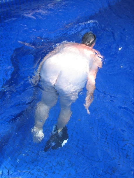 Fat nan Girdle Goddess goes for a skinny dip in a backyard pool