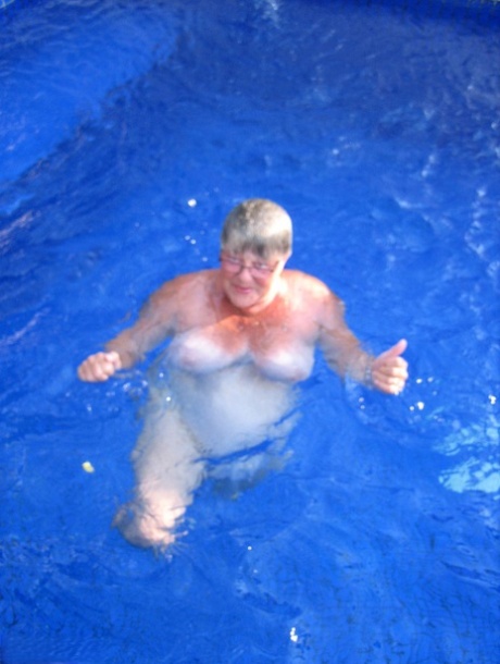Fat nan Girdle Goddess goes for a skinny dip in a backyard pool