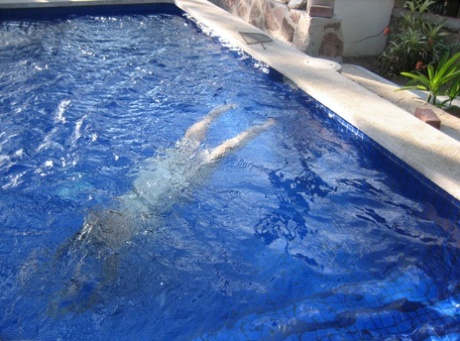 Fat nan Girdle Goddess goes for a skinny dip in a backyard pool