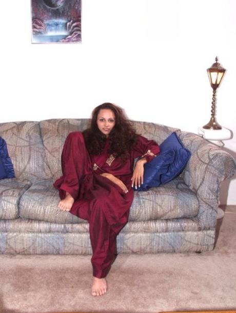Indian solo girl gets completely naked upon a chesterfield
