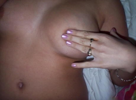 Brunette teen Nikki takes tempting safe for work self shots while undressing