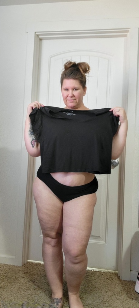 Fat amateur Busty Kris Ann strips completely naked on carpeted flooring