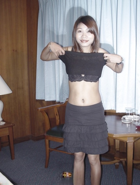 Brunette Asian babe Gulp is demonstrating her small boobies