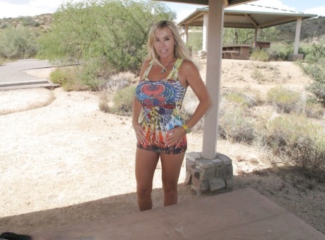 Stunning MILF with big tits and slender legs Wifey stripping outdoor