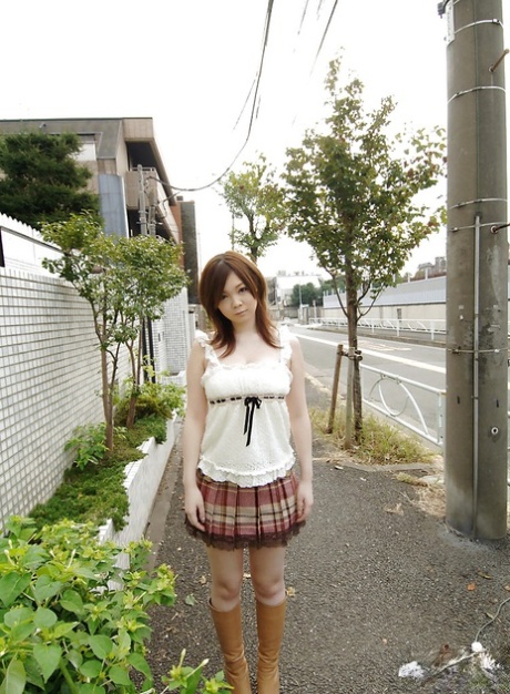 Asian schoolgirl Nami Ogawa revealing her massive bosoms and nice fanny