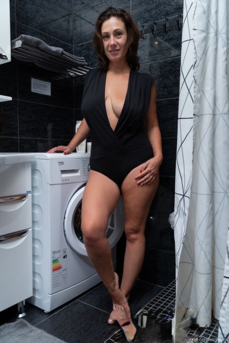 Hot cougar Gadget exposes her big breasts and fingers her hairy vagina