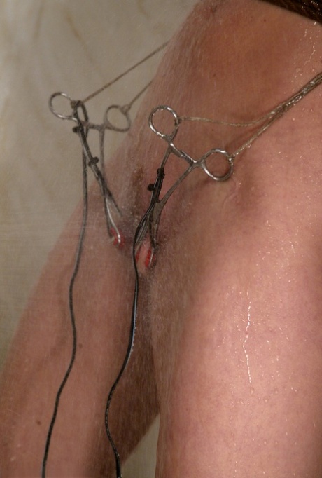 Sexy babe Roxanne Hall flaunts her big tits during an electrical play session