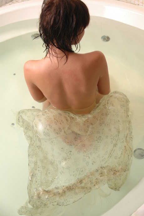 Teen with amazing big boobs Lucy C showers her alluring curvy body