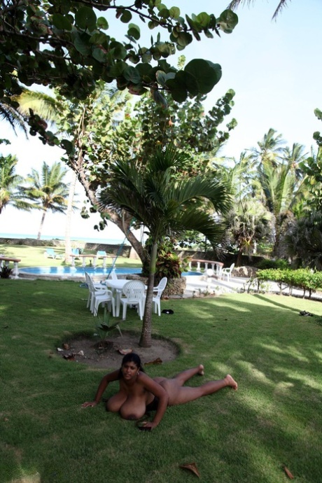 Puerto Rican woman Kristina Milan displaying her very big tits outdoors