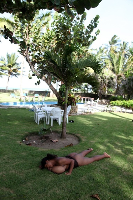 Puerto Rican woman Kristina Milan displaying her very big tits outdoors