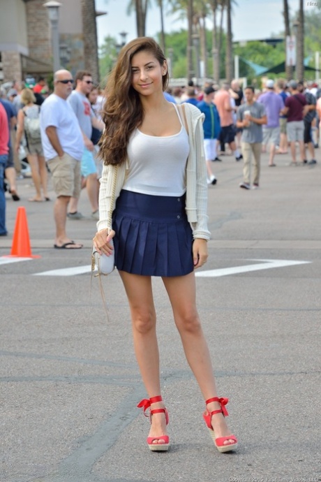 Glamour babe Nina gives a tempting upskirt in public & unveils her juicy tits