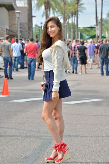 Glamour babe Nina gives a tempting upskirt in public & unveils her juicy tits