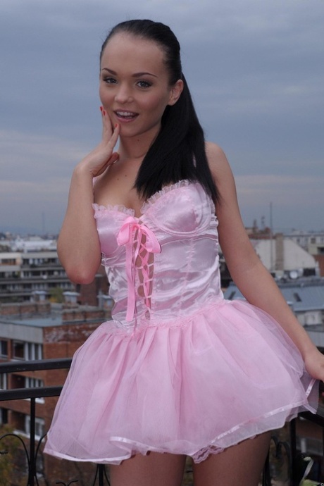 Cute petite teen Anabell Bella lifts her pink dress and sits on a hard boner