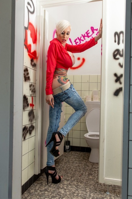 MILF Tanya Virago unveils her big tits & sucks a dick through a gloryhole