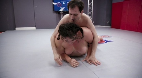 Chubby wrestler Mimosa analizes a male loser with her strapon dildo