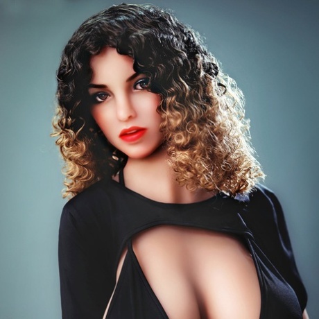 Gorgeous curly haired sex doll shows off her large breasts & her big ass