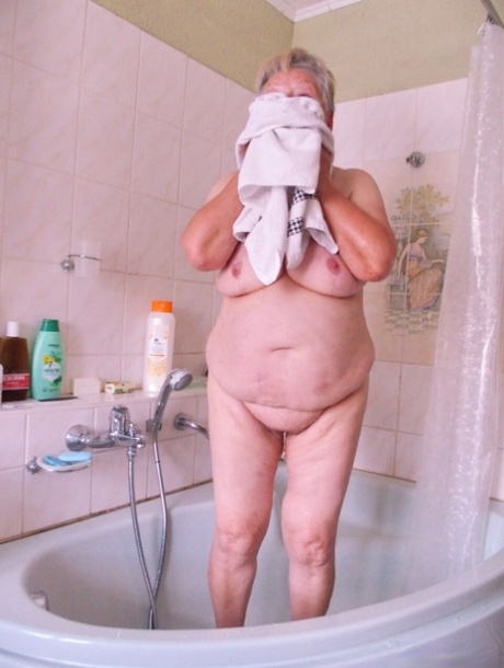Granny Oma Geil washes her saggy tits and mature holes before getting dressed
