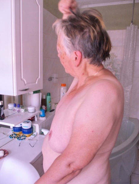 Granny Oma Geil washes her saggy tits and mature holes before getting dressed